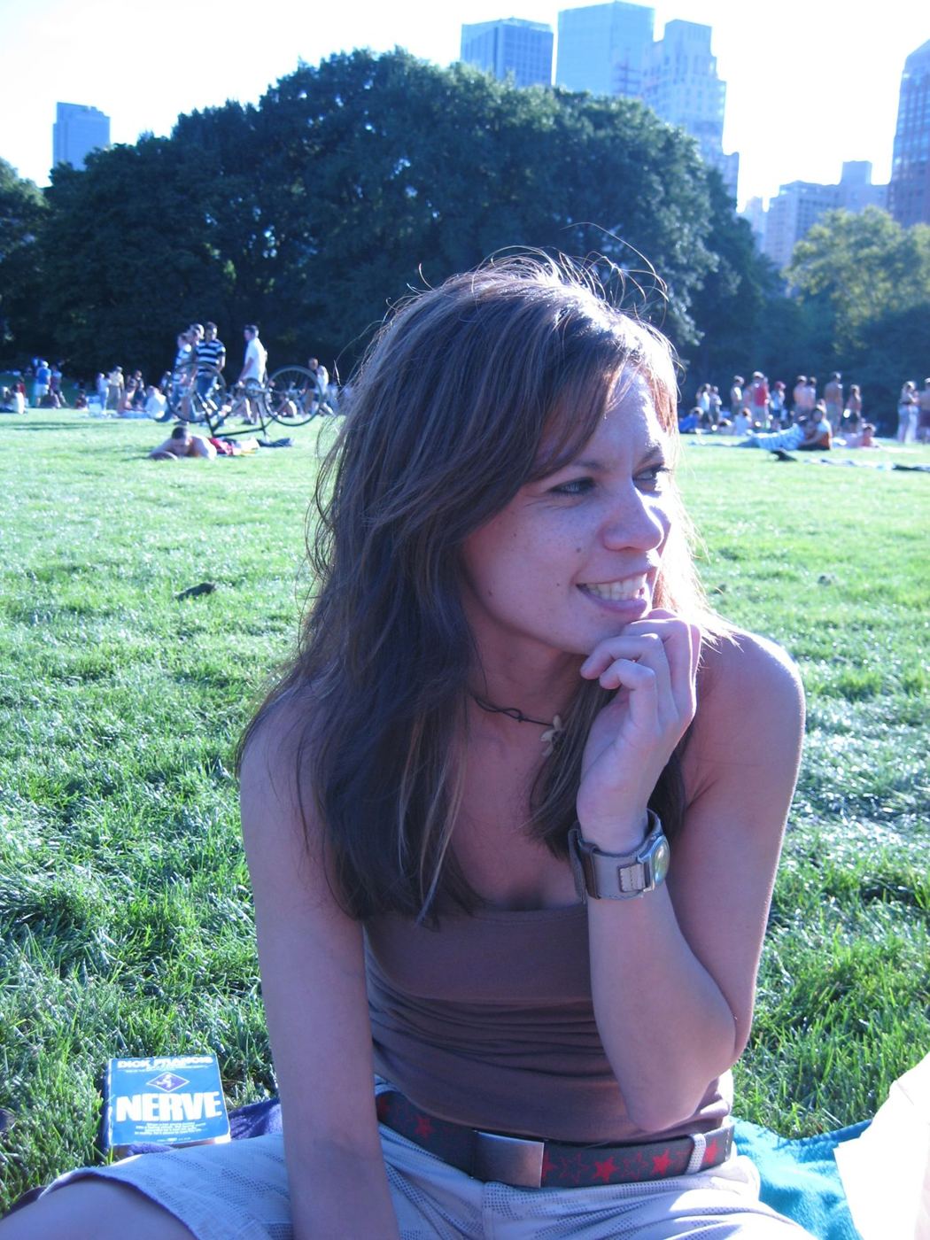 Gweneviere Mann sitting in the grass in Central Park, smiling